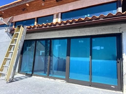 Commercial impact sliding doors installed by ALCON